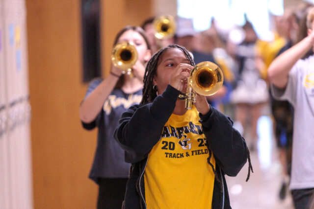 Marching to the Magic: Garfield Band Plans Return to Walt Disney World Freshman trumpeter Sunny Oliver performs with the Marching Pride as they parade through the hallways of GHS ahead of a homecoming Pep Rally. Photo: Benjamin Coll/JAG Schools