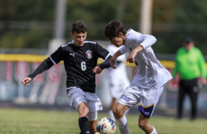 Red Devils Soccer Uses First Half Flurry to Bury Badgers Crestwood #6 Hans Seibold battles Berkshires #3 John Murphy | Photo: Anton Albert Photography