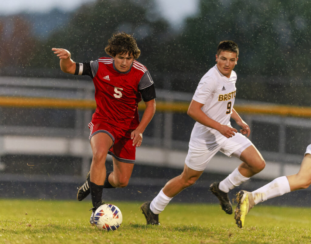 Crestwood #5, Elijah Jurisch races toward the goal with Bristols #9, Ethan Hauser closing in