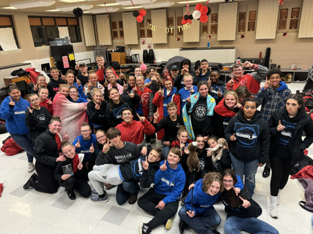 The Scarlet Guard celebrates their Superior Rating at the recent OMEA contest at Copley HS