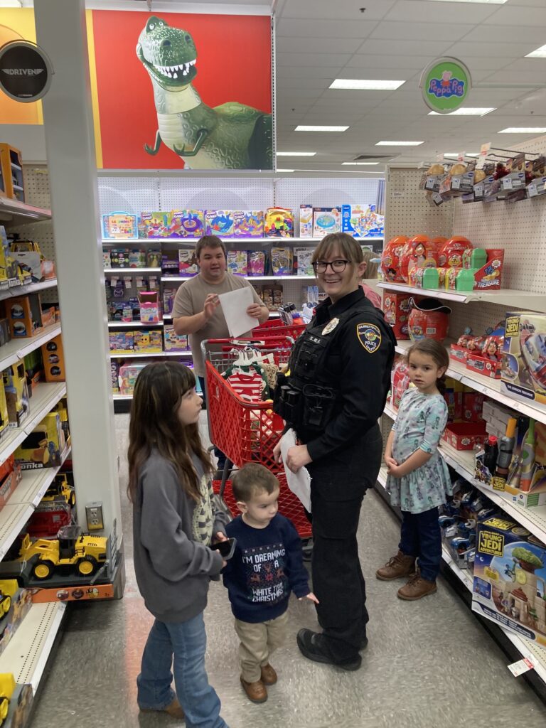 Decisions, Decisions: Police Officers from Hiram and Garrettsville (including GPD’s Student Resource Officer Emily) helped children and families do holiday shopping at the fun community-focused event.