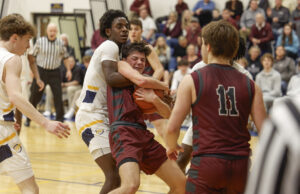Rockets boys basketball hangs in to defeat Woodridge