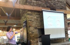 Logan Griffin presents salamander research at Vernal Poolooza