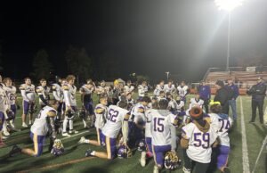 Badgers’ football seizes momentum in second half, shut out Tigers The Berkshire Badgers Football Team huddles following their regular season finale/Photo by Daniel Sherriff