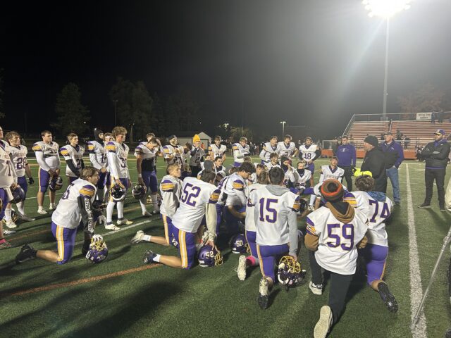 Badgers’ football seizes momentum in second half, shut out Tigers The Berkshire Badgers Football Team huddles following their regular season finale/Photo by Daniel Sherriff