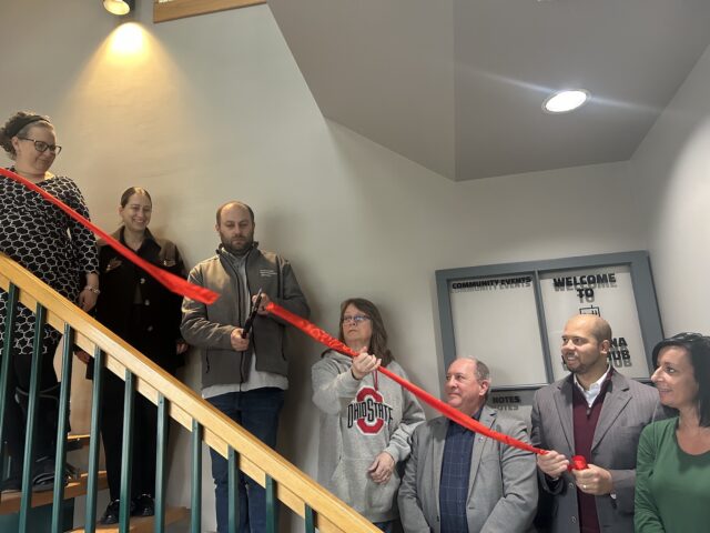 Prominent Members of Ravenna Work Hub and community gather for the ribbon-cutting ceremonyPhoto by Daniel Sherriff
