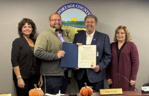 New Preparedness Certification Program For Portage Communities, Local Government & Organizations From Portage County EMA Pictured left to right are: Portage County Commissioner Sabrina Christian-Bennett, board of commissioners vice president; Portage County Emergency Management Agency Director Ryan Shackelford; Commissioner Mike Tinlin, board of commissioners president; and Commissioner Jill Crawford.