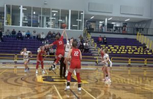 Badger girls’ basketball learns hard lesson in loss against Bobcats Badgers' sophomore forward Stella Bateman jumps for the opening tip against Norwayne/Photo by Daniel Sherriff