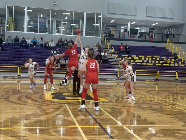 Badger girls’ basketball learns hard lesson in loss against Bobcats Badgers' sophomore forward Stella Bateman jumps for the opening tip against Norwayne/Photo by Daniel Sherriff