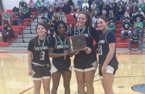 DISTRICT RUNNERS-UP: Rocket girls’ basketball ends district title reign in loss against Warriors The Streetsboro girls' basketball team holds the OHSAA Division IV Northeast 2 district runner-up trophy following a 50-40 loss against West Branch in the district championship last Saturday at Lordstown High School/Photo by Daniel Sherriff