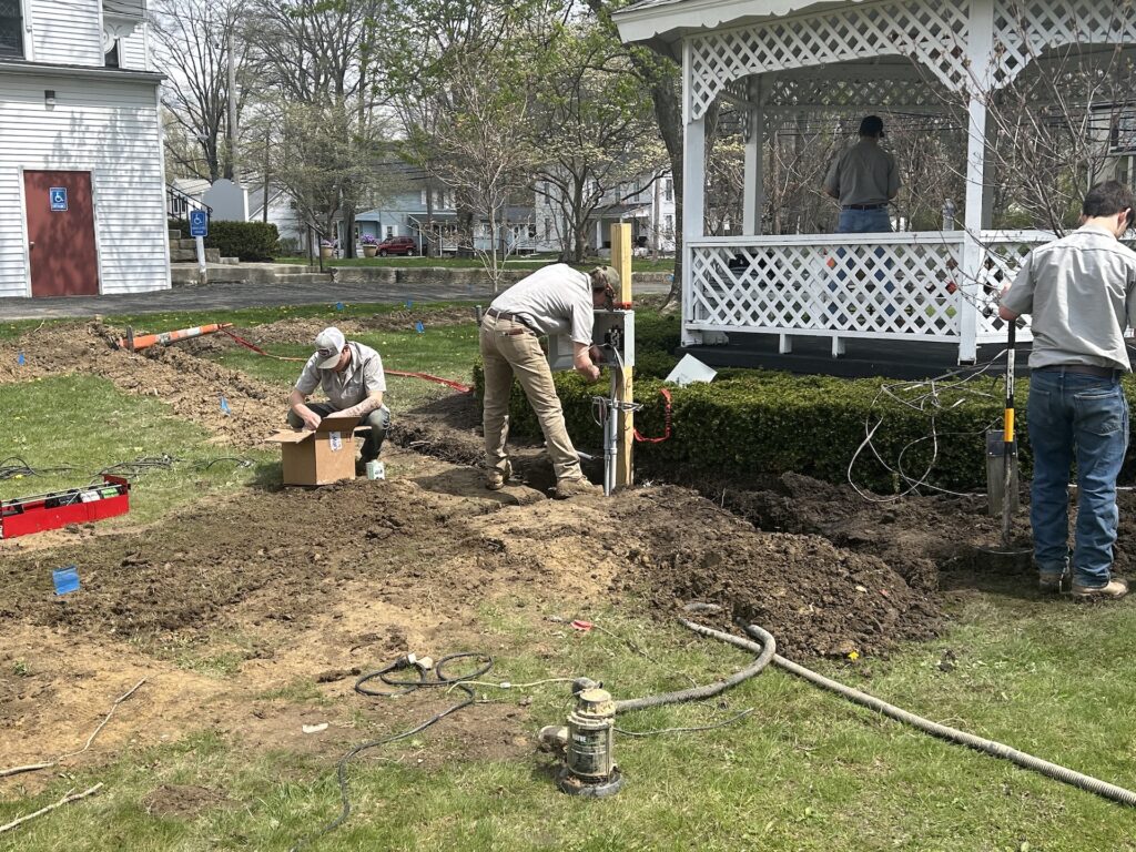 Maplewood Career Center students work to lay the power lines for Windham Township's street clock and gazebo/Photo by Daniel Sherriff
