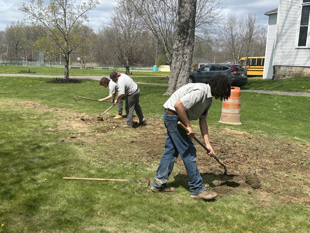 Maplewood Career Center students work to lay the power lines for Windham Township's street clock and gazebo/Photo by Daniel Sherriff