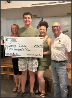 Jaxon Cushing receives a scholarship from the Garrettsville Eagles Scholarship Committee on June 10