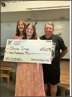 Olivia Grcar receives a scholarship from the Garrettsville Eagles Scholarship Committee on June 10