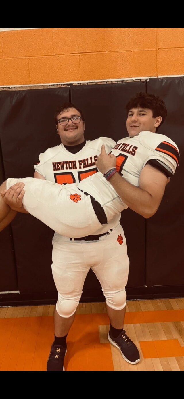 Spencer Sabo cleared to return to the Tigers Team Teammate Landon Bryant holding Spencer Sabo