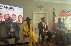 Hope Town Ohio hosts Artificial Intelligence Summitt CEO of AI OWL Cas Maxwell (far left), Founder & CEO of Life Inspired Nyla Christian (wearing yellow), Regulatory Attorney at Taft Law Eric Leach (middle), and Hope Town Ohio CEO Ted St. John (far right) sit on the panel of AI Experts at Hope Town Ohio's AI Town Hall Summit last Thursday morning in Windham - Photo by Daniel Sherriff