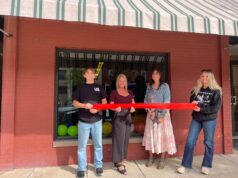 Ruoff Mortgage opens new branch in Ravenna Ruoff Mortgage Senior Loan Officer Tara Jenior (second from right) proudly cuts the ribbon to commemorate the grand opening of Ruoff Mortagage's Ravenna Branch alongside her children Kolten (far left), Koralee (far right) and Ravenna Mayoral Candidate Cherly Wood (second from left) - Photo courtesy of Tara Jenior